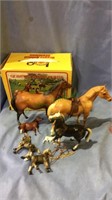 Box set of three Breyer horse figures and four