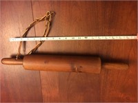 Antique rolling pin with strap