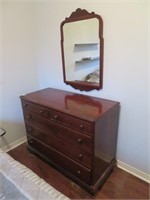 A Walnut Chest of Five Drawers With Mirror