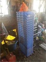 Large stack of blue plastic containers