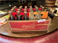 Vintage Cocoa Cola bottles most are full