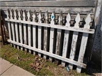 3 sections of white picket fence