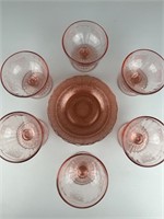 Pink embossed depression glass saucers cups