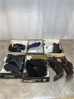 Assortment of high heel boots, most appear to be