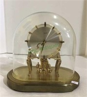 Kundo brass mantle clock oval shaped with glass