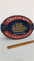 Cruzan rum oval tin sign.  23x15