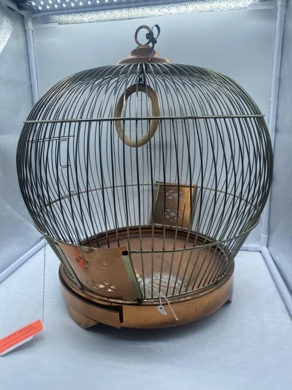 Metal bird cage. 
Refbooth45