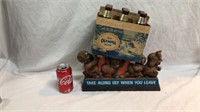 Olympia beer advertising hangs or sets