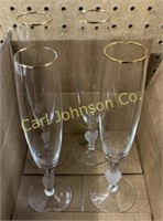 SET OF 4 WATERFORD CRYSTAL FLUTES W/ GOLD RIMS