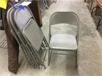 Four like new metal folding chairs.  Shipping not