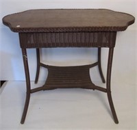 Wicker table with wood top. Measures 30" h x 35"