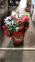 Bucket of fake flowers
