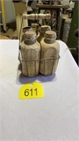 Metal crate with wooden jugs