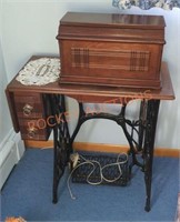 Antique singer sewing machine with cabinet and