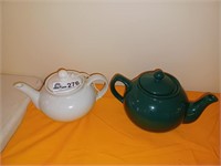 1 white and one dark green tea pots