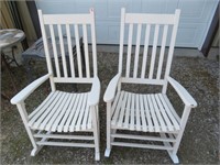 2 white wooden rocking chairs