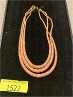 coral/pink like necklace