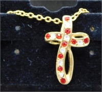 Gold plated cross necklace.