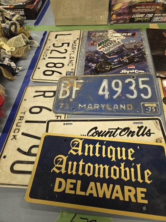 Group of license plates and NASCAR advertising