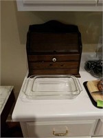 Wooden bread box with Pyrex baking dishes