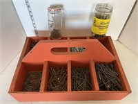 Wood tool caddy full of nails