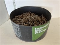 Black container full of nails