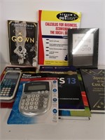 Scientific calculator, books and photo frame
