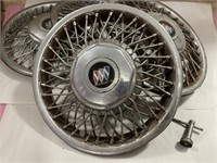 Buick hubcaps with a tool
