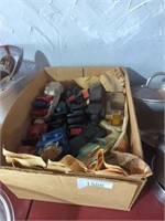 Box of vintage Avon car cologne bottles