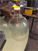 Glass bottle with leaf print