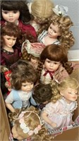 12 porcelain collectors dolls, some on stands,