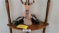 Native American & Skunks statue