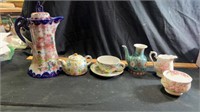 Tea pitchers, cups & saucers