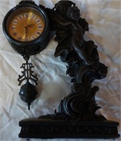 figural quartz table clock