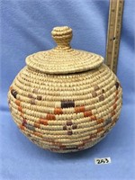 Handmade grass basket with dyed grass accents, lid