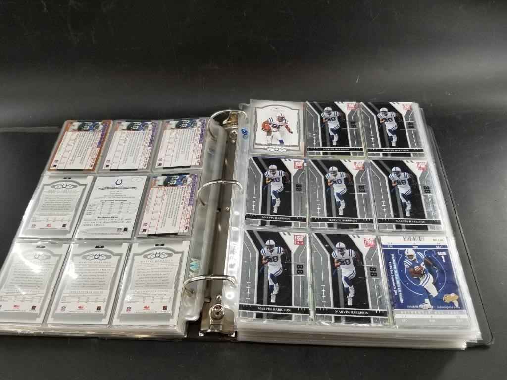 Large binder of NFL trading cards, contains many c