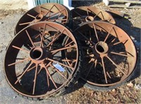 (4) Antique steel wheels. Measures 34" diameter.