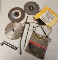 Assorted saw blades, small bungee, tire air tool