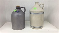 (2) stoneware jugs. Larger jug has crazing all
