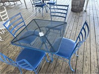 Wrought iron table with 4 padded chairs