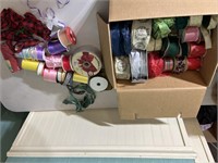 Box of rolls of ribbon for crafts or wrapping