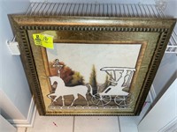 Gold colored framed horse and buggy silhouette