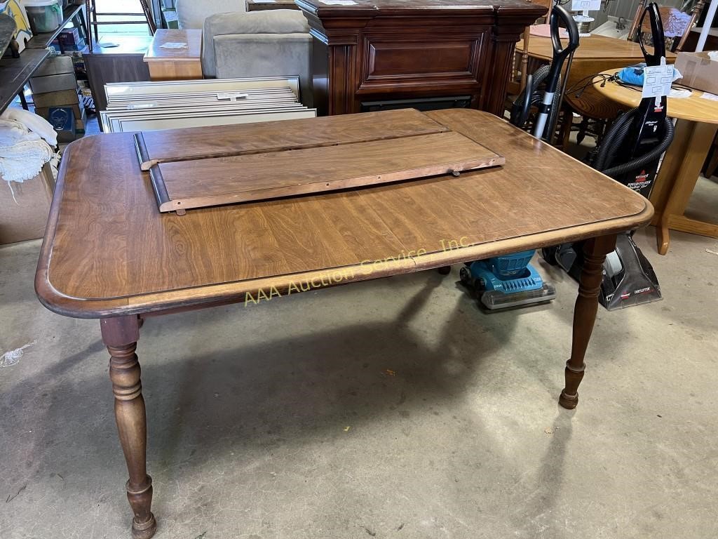 Wood dining table with 2 extension leaves.  29” H