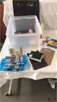 Container with misc items: pens, note pad,