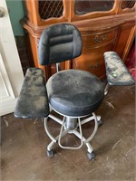 Black rolling chair with arm