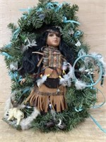 Porcelain Indian doll in wreath