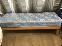 TWIN BED ON WOODEN FRAME