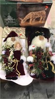 Two decorative Santa Christmas stockings one has