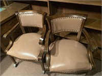 Two vintage rolling office armchairs