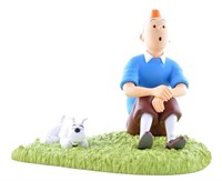 Tintin. Statuette Tintin assis dans l'herbe